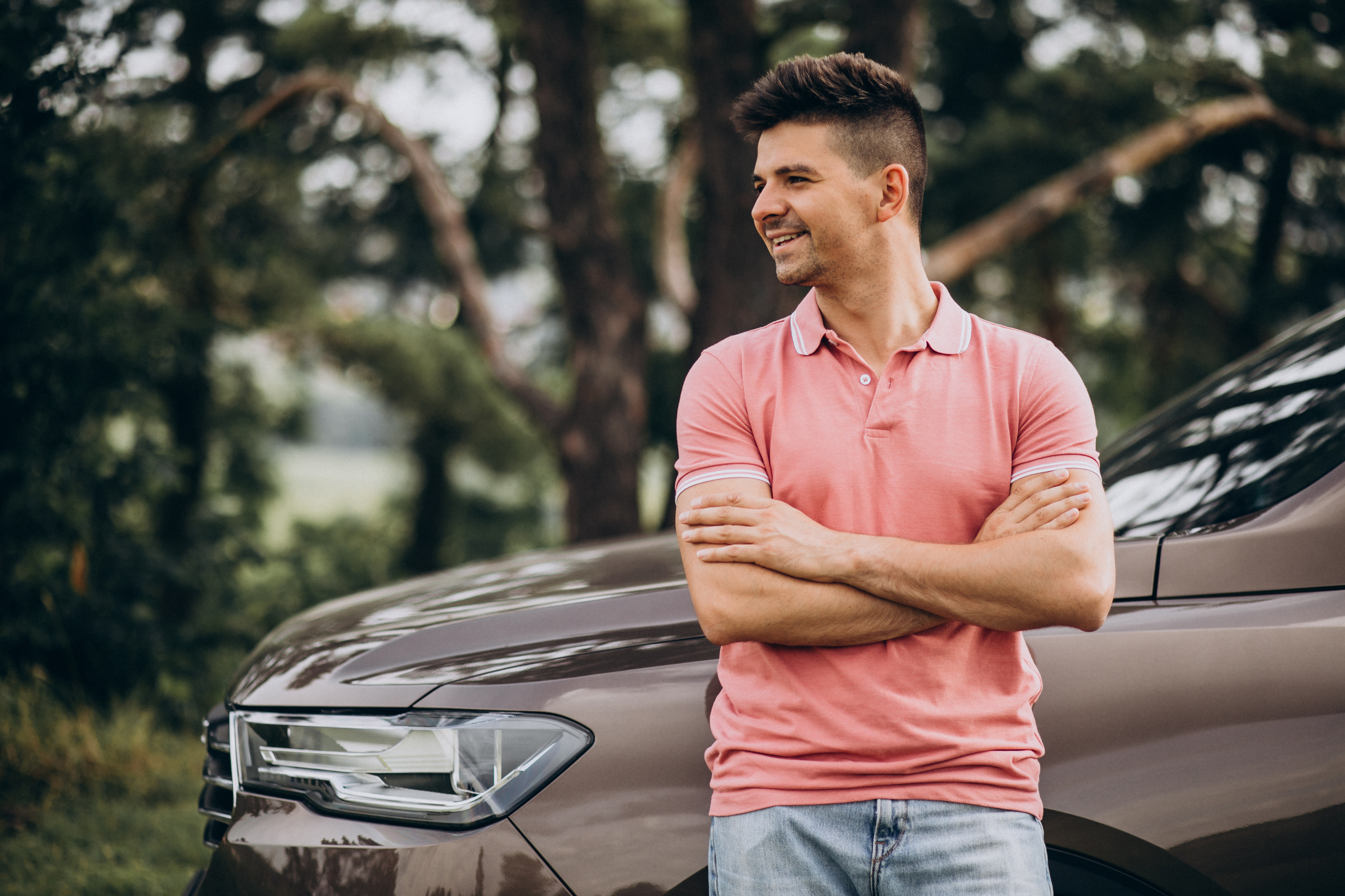 handsome-man-standing-by-his-car